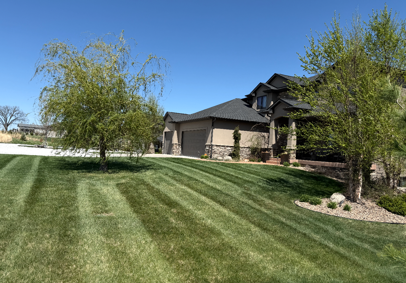 Perfectly striped green lawn at golden hour